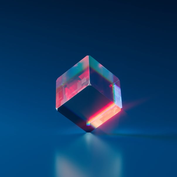 transparent cube balancing on its corner in a blue background